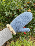 Blue crochet mittens with cream frill