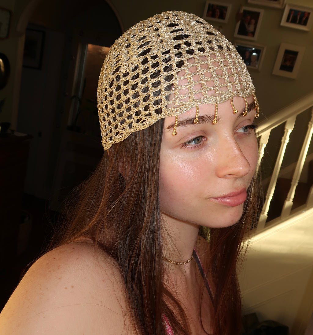 Gold sparkly beaded mesh hat