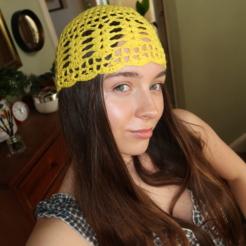 Yellow crocheted mesh hat