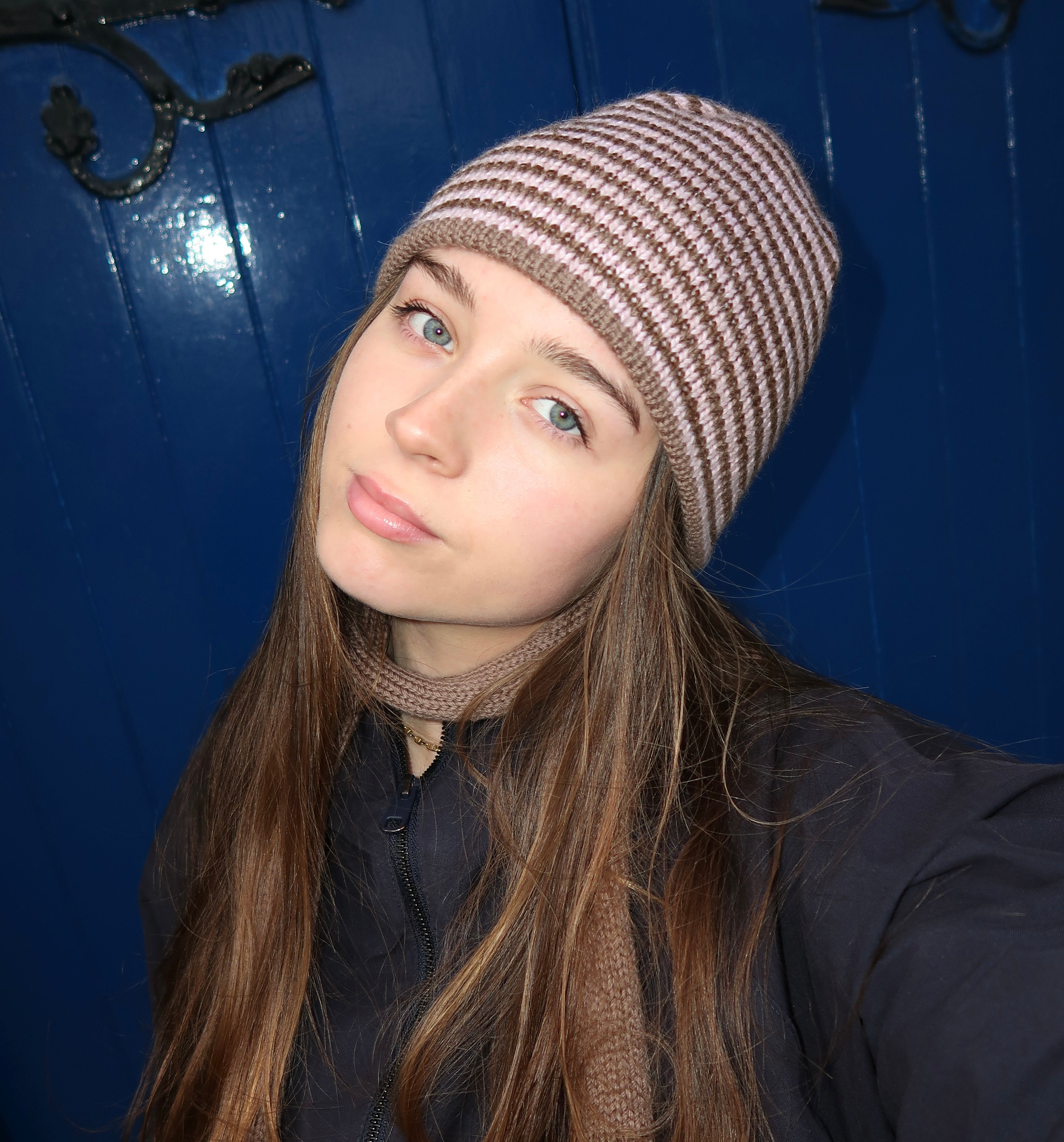 Reversible pink and brown striped beanie