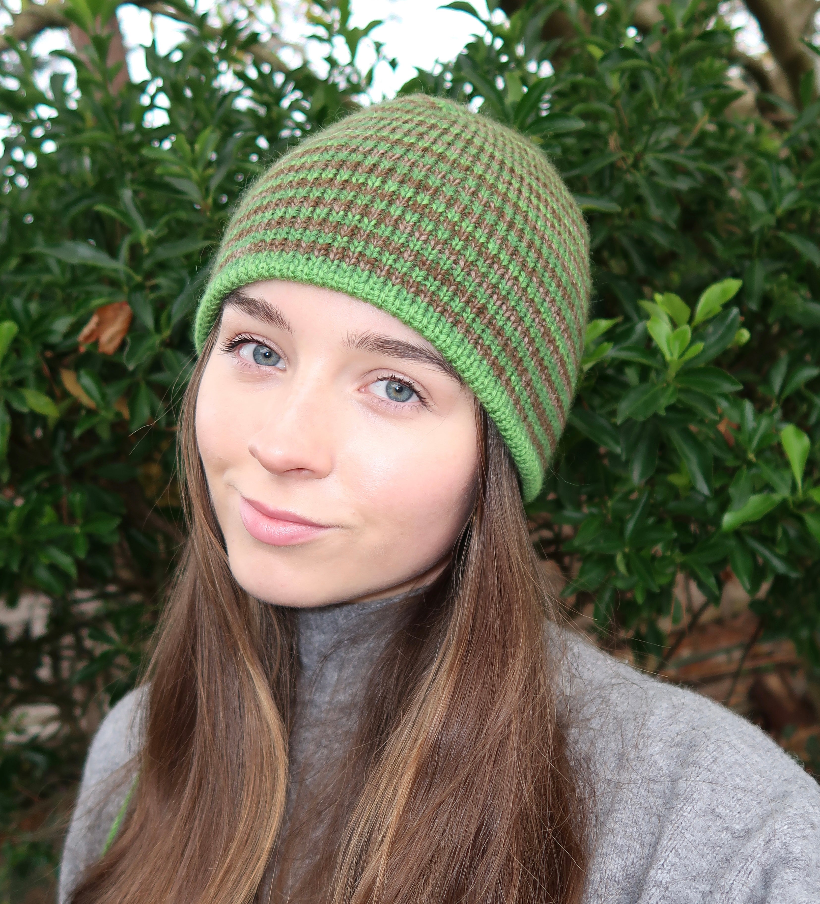 Reversible green and brown striped beanie