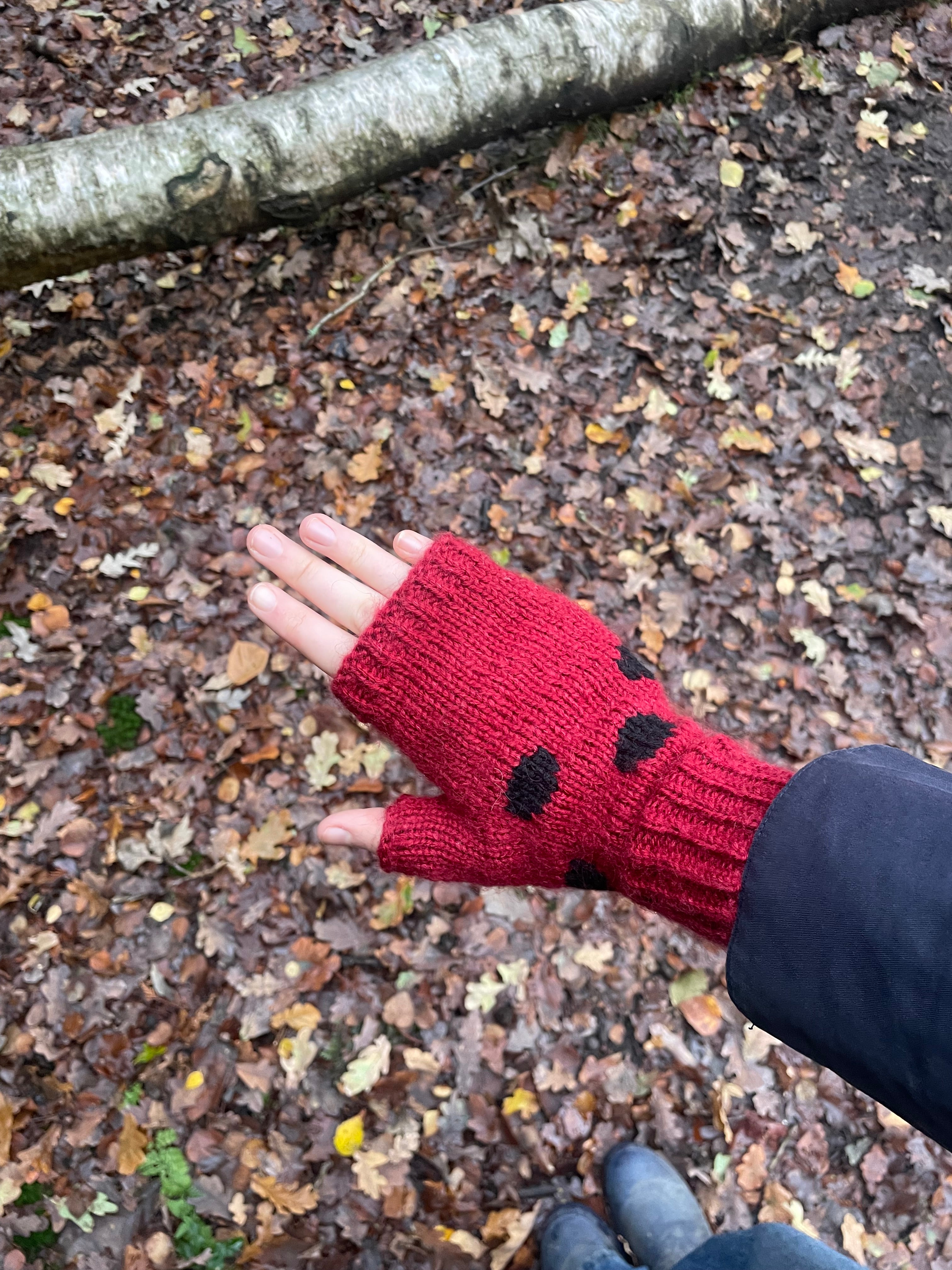 Red and black polka dot fingerless gloves
