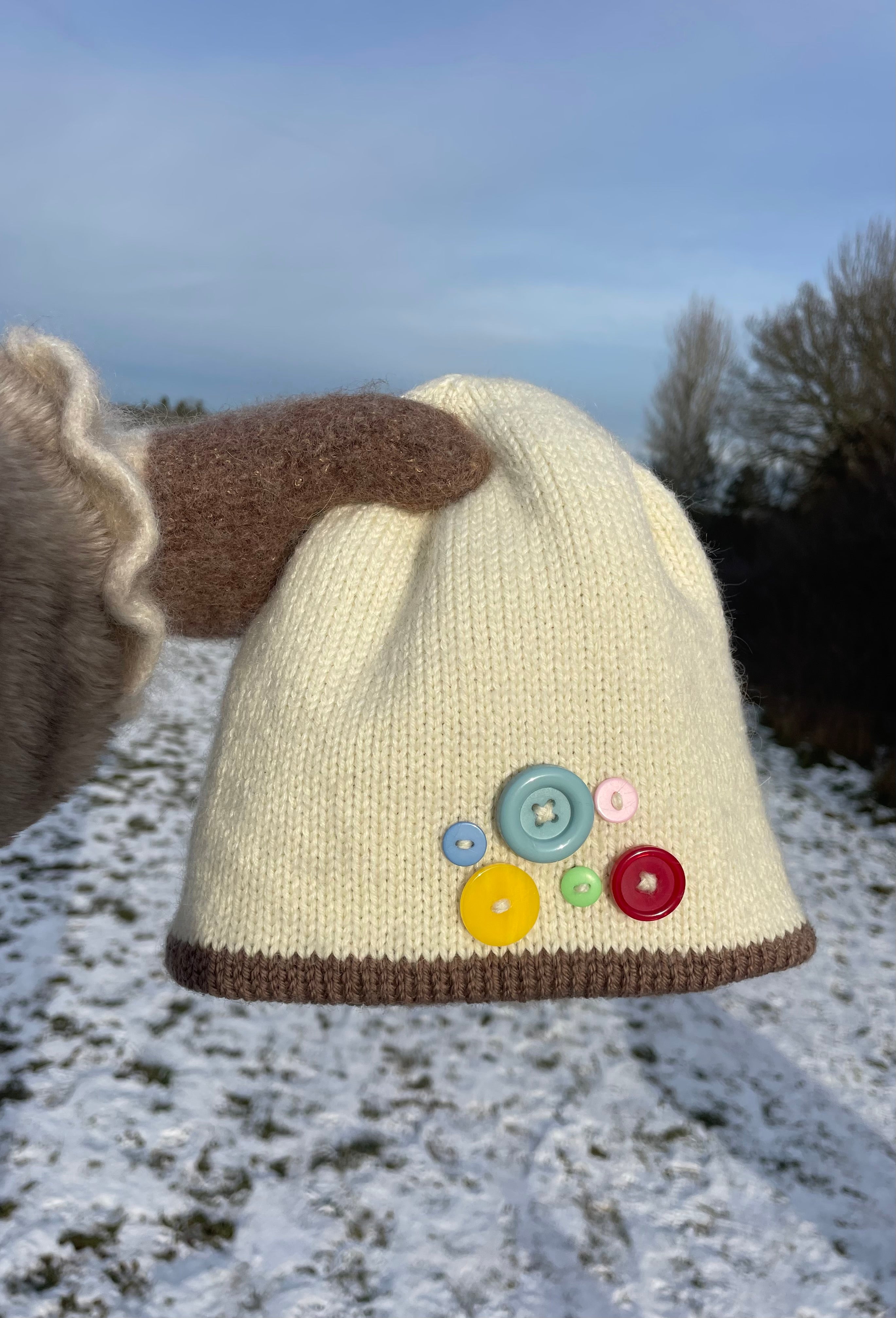 Cream and brown button beanie
