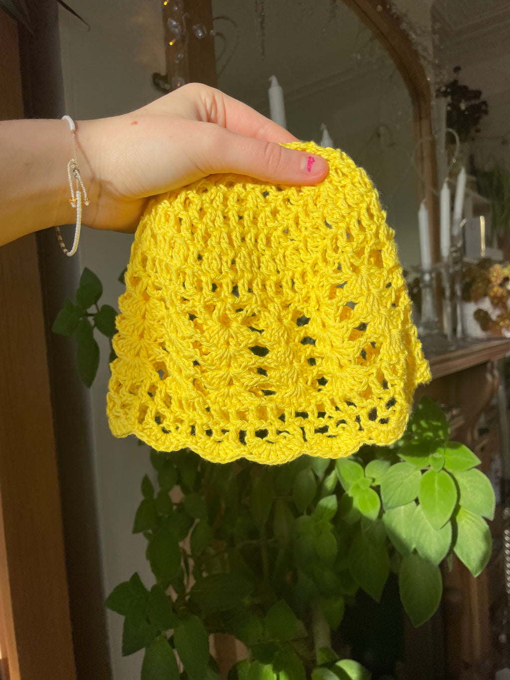 Yellow crocheted mesh hat
