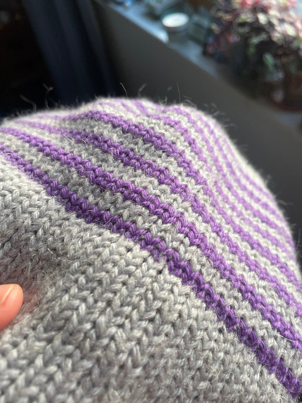 Grey and purple striped earflap beanie