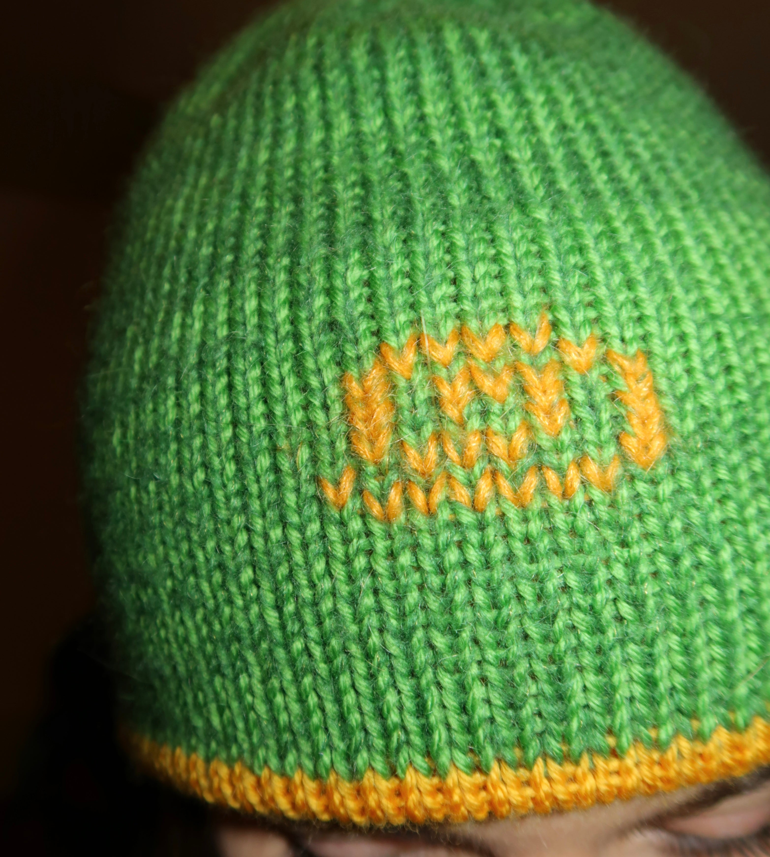 Reversible green and mustard swirl beanie