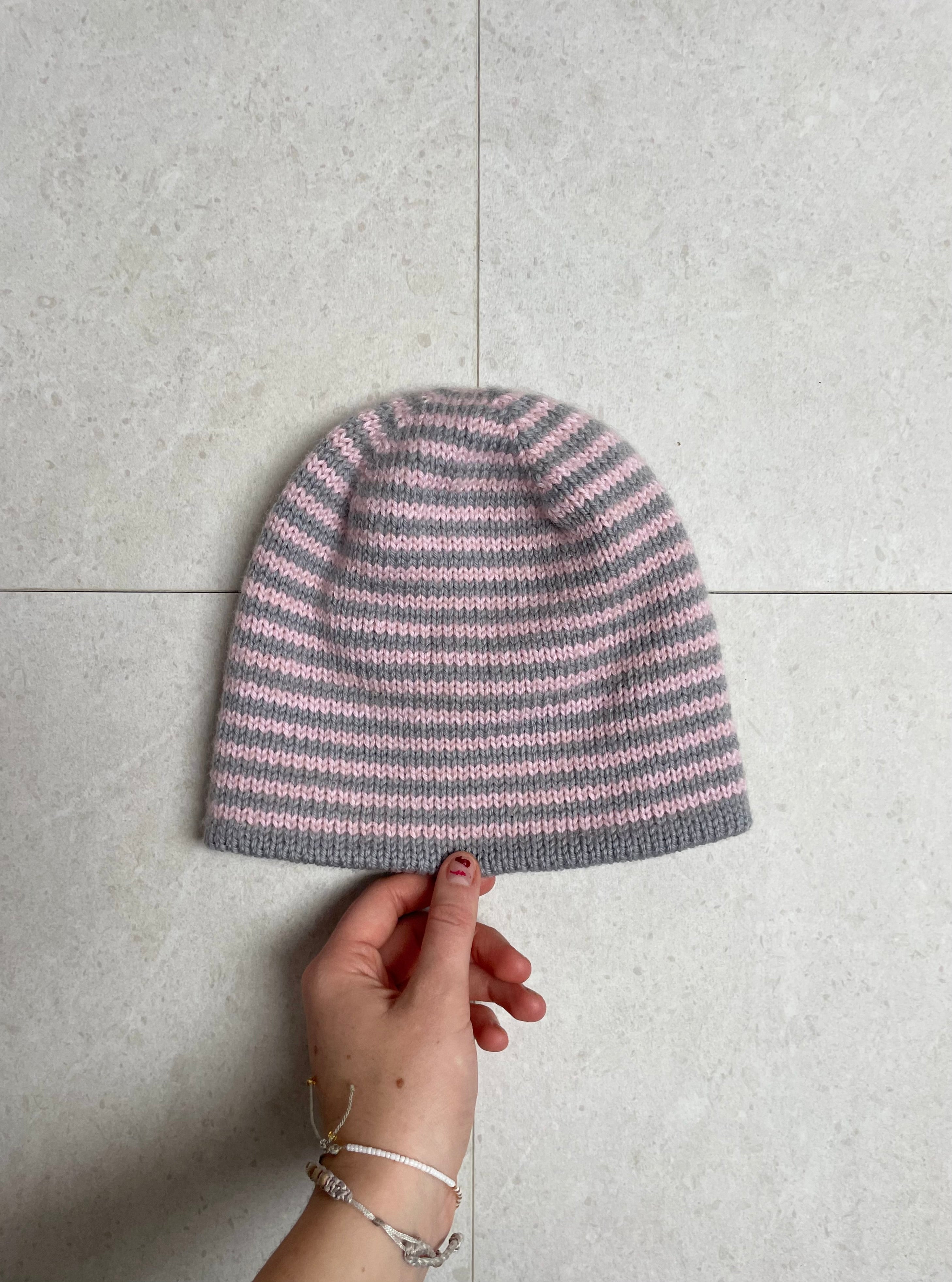 Reversible pink and grey striped beanie