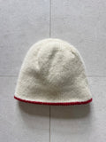 Reversible cream beanie with dark red lining