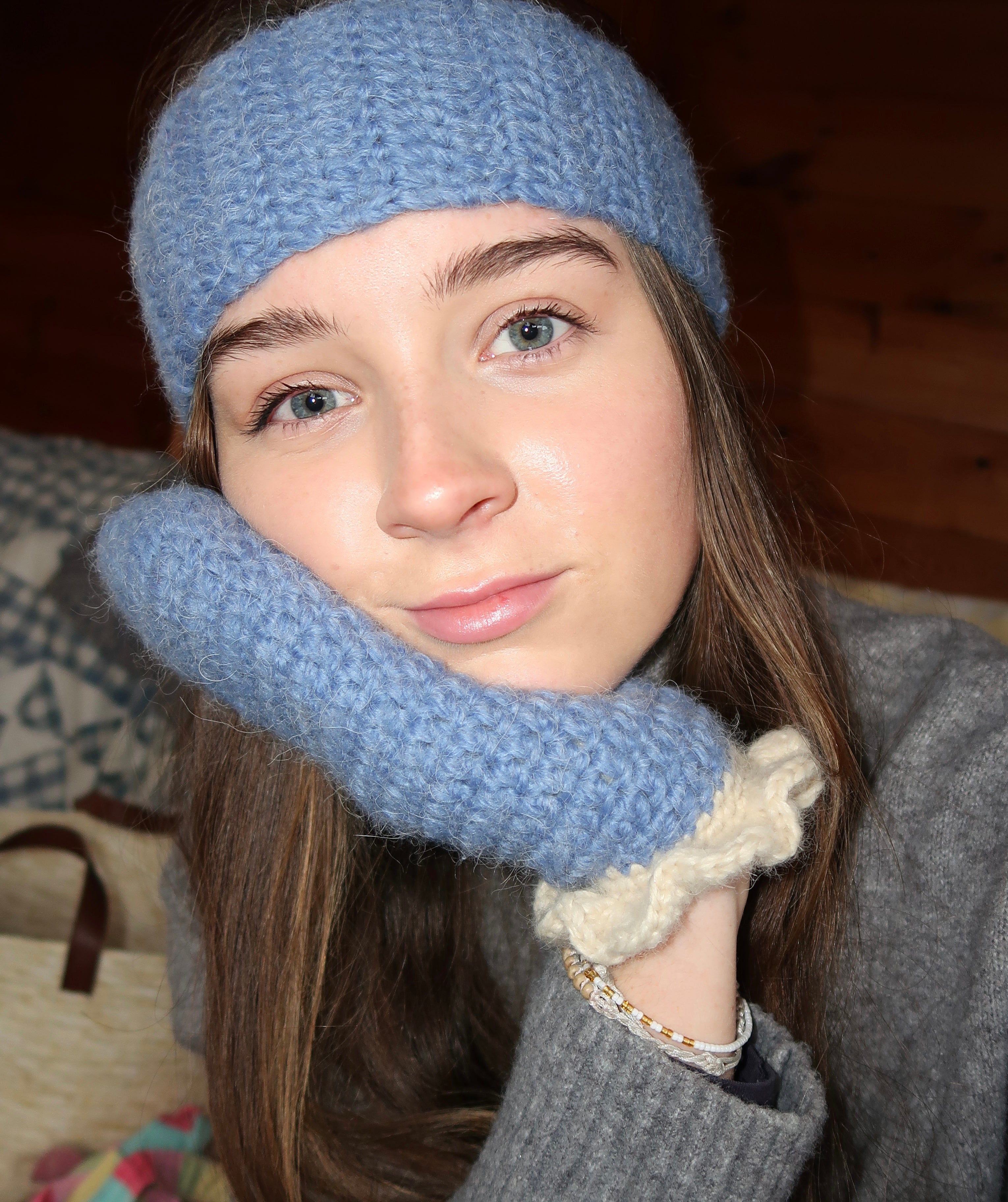 Blue crochet mittens with cream frill