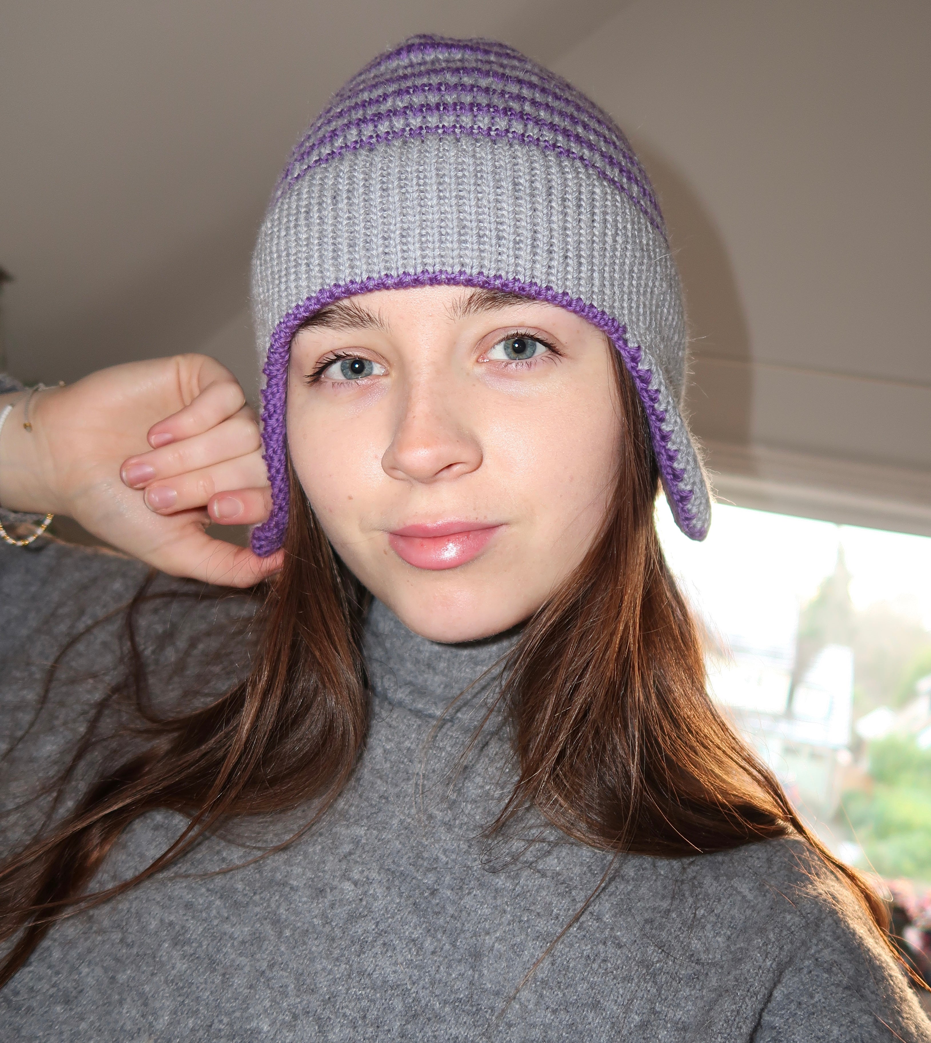 Grey and purple striped earflap beanie