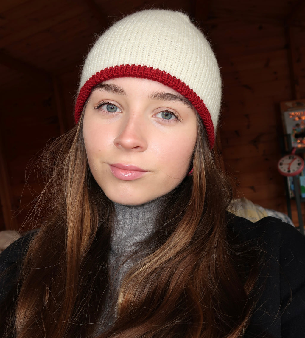 Reversible cream beanie with dark red lining