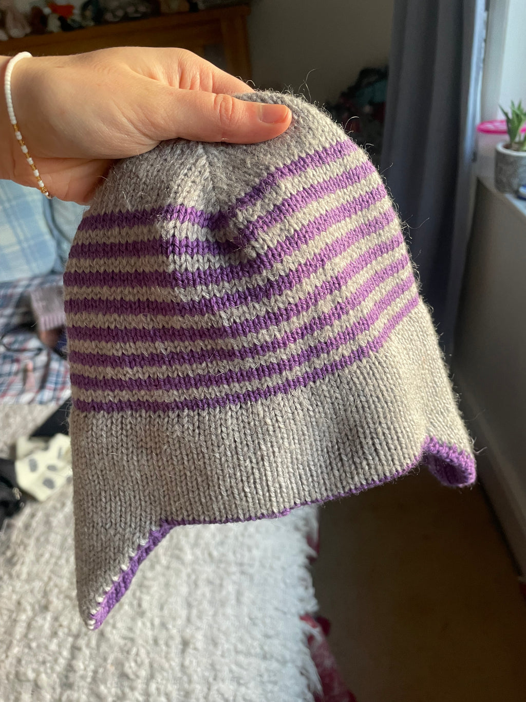 Grey and purple striped earflap beanie