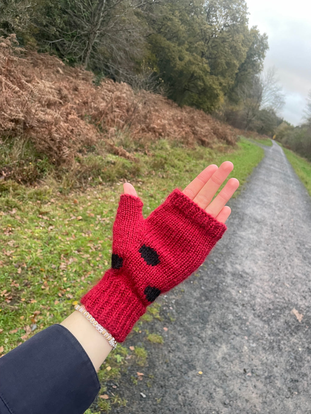 Red and black polka dot fingerless gloves