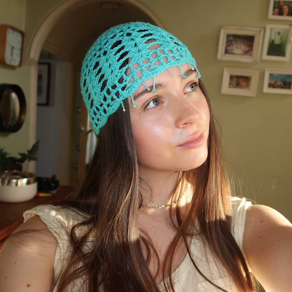Light blue beaded crochet mesh hat
