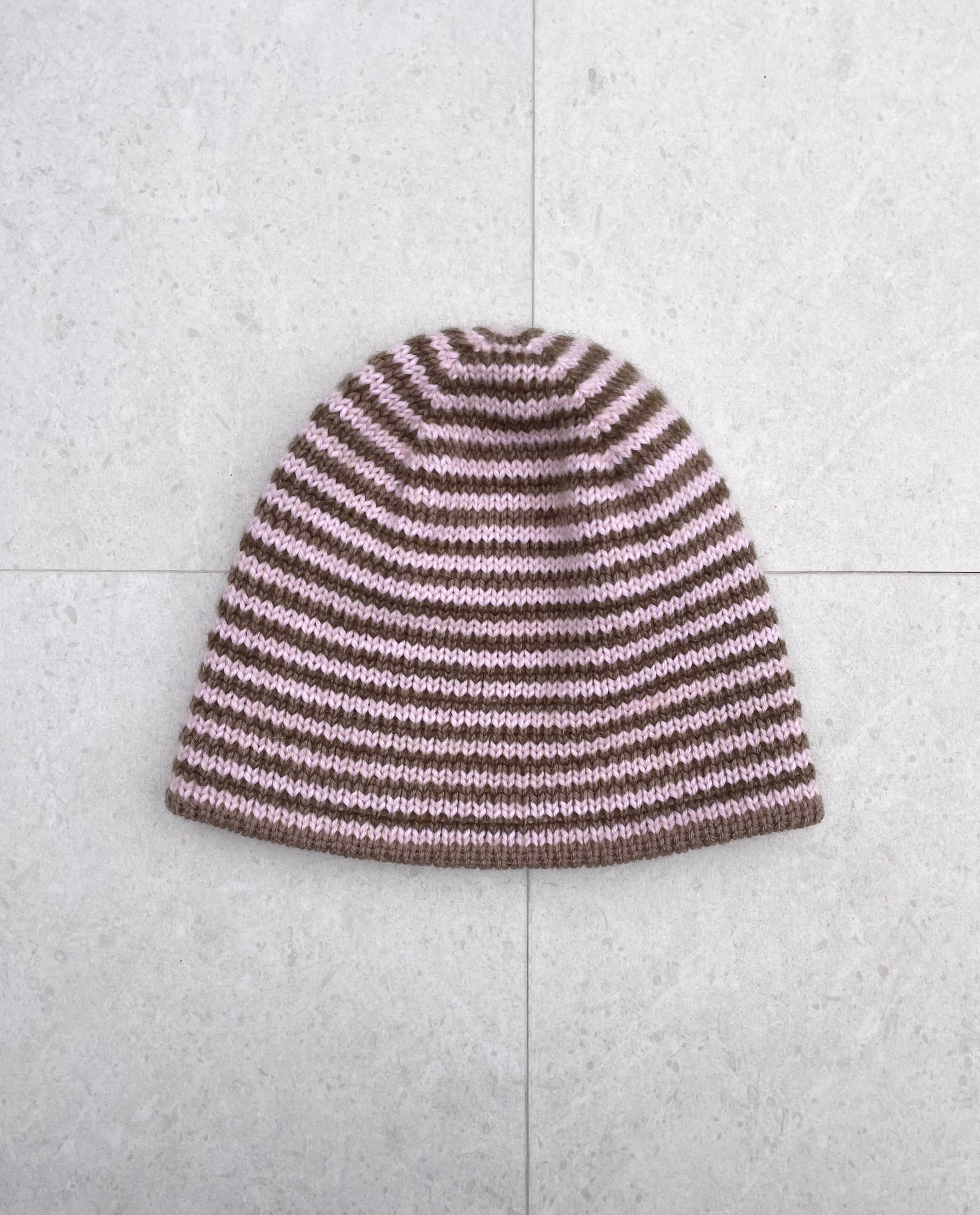 Reversible pink and brown striped beanie